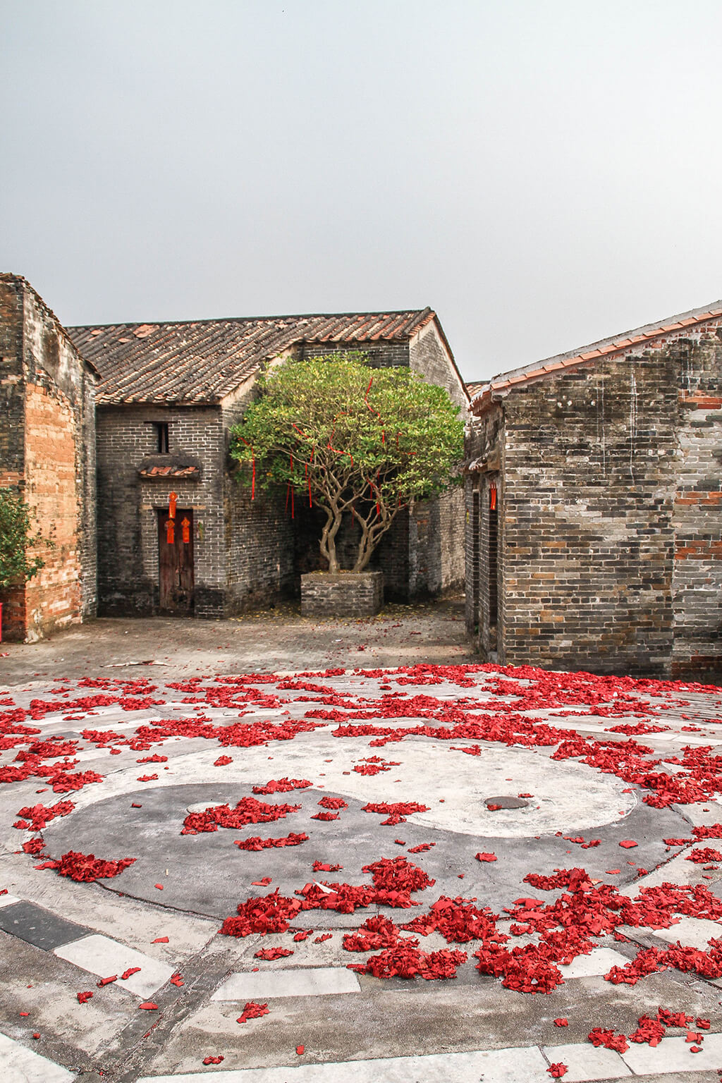 a picture showing the central square of the village wit the taiji symbol in the middle